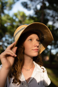 Portrait of young woman wearing hat