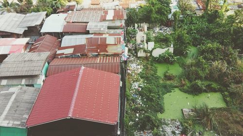 High angle view of houses by trees