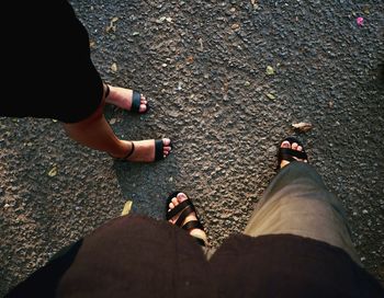 Low section of people standing on street