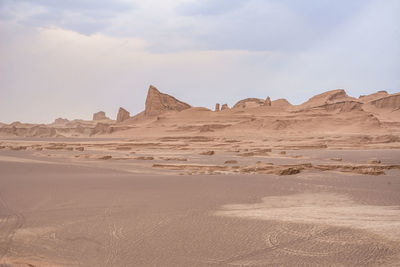Scenic view of desert against sky