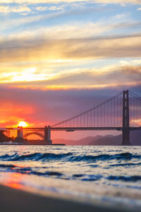 View of suspension bridge at sunset