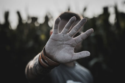 Close-up of hand against blurred background