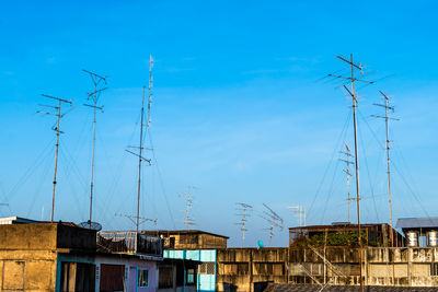 Low angle view of buildings against blue sky