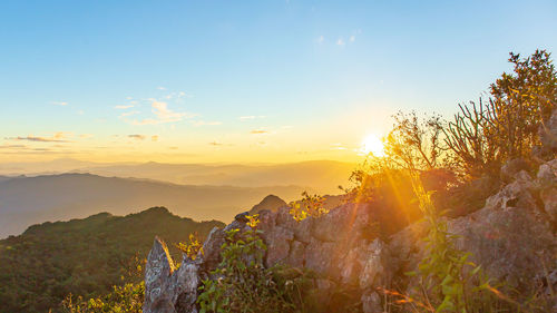 Scenic view of mountains against sky during sunset