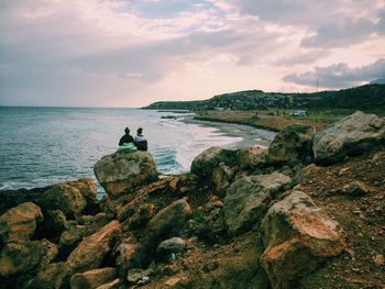 Scenic view of sea against cloudy sky