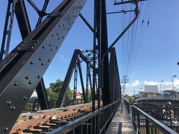 Low angle view of railway bridge against sky