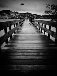 Wooden pathway along trees