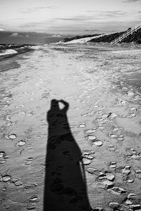 Shadow of people on beach