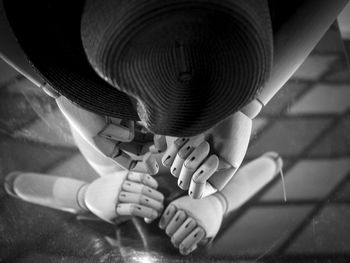 Low section of child holding metal on floor