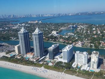 Helicopter view of miami beach with cityscape and views of the ocean