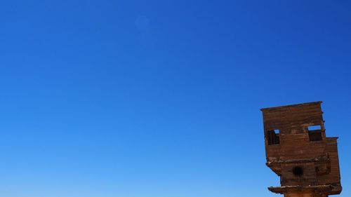 Low angle view of building against blue sky