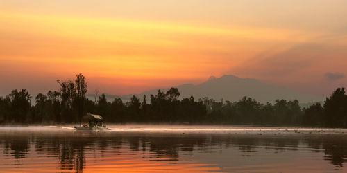 Scenic view of xochimilco against sky during sunset