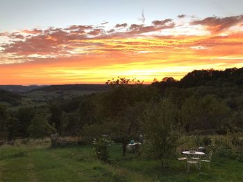 Scenic view of landscape against sky during sunset