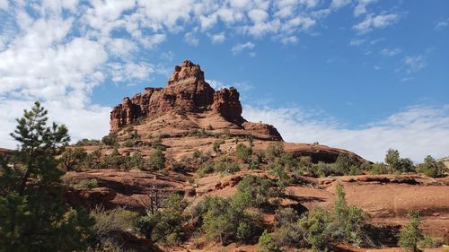 Low angle view of rock formation against sky