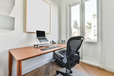 View of chair by desk in study room