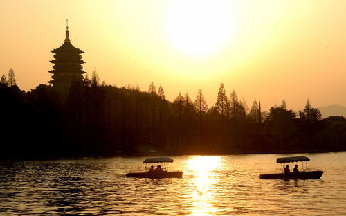 Scenic view of lake against sky during sunset