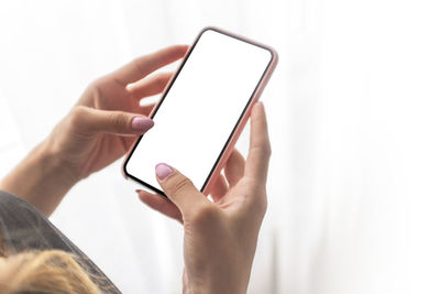 Midsection of man using mobile phone
