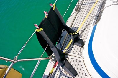 High angle view of wetsuit on ship in sea