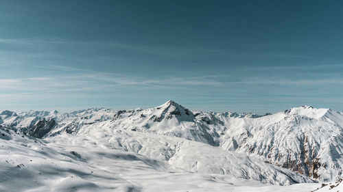 Scenic view of snowcapped mountains against sky