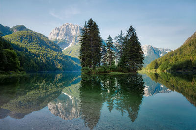 Scenic view of lake and mountains against sky