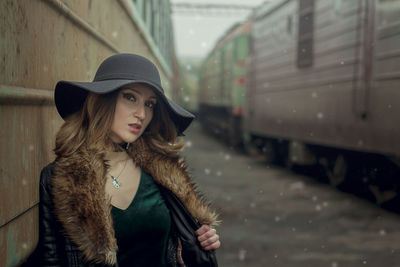 Portrait of young woman in snow