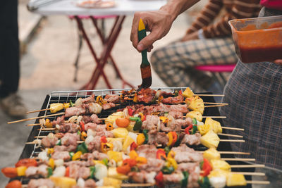 Close-up of hand holding meat at market stall
