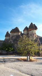 Built structure by sea against sky