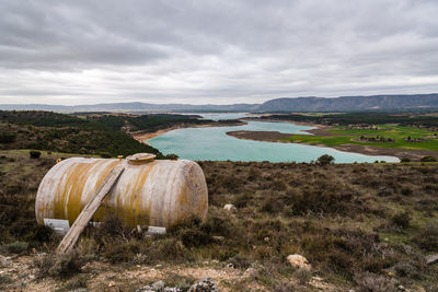 Fiberglass water tank and reservoir with turquoise waters in spring on background. 