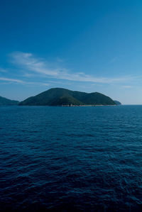 Scenic view of sea against blue sky