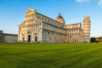 Pisa leaning tower and pisa cathedral at piazza dei miracoli or square of miracles in pisa, italy