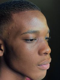 Close-up portrait of young man looking away