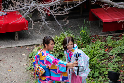 Girl standing with umbrella