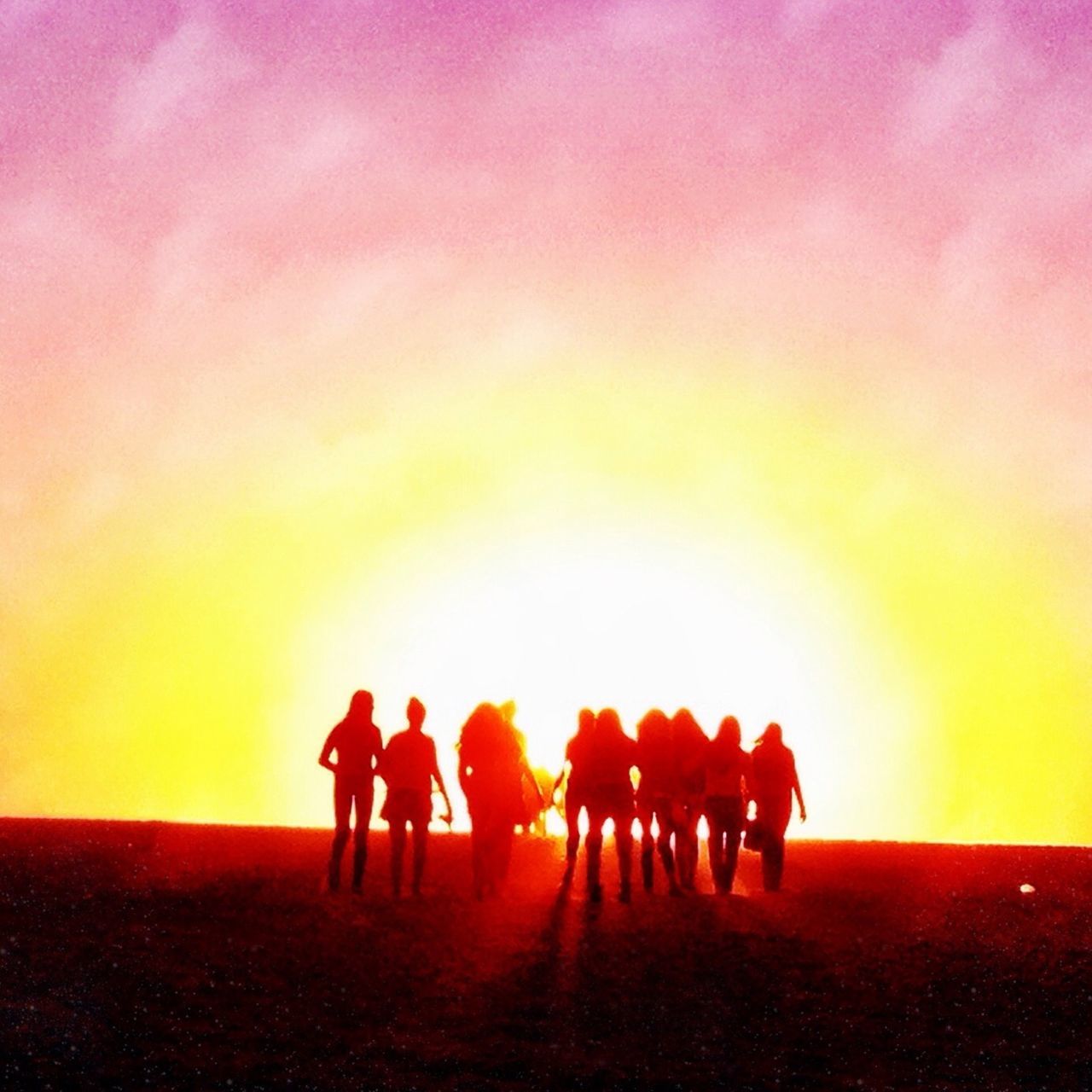 SILHOUETTE PEOPLE STANDING AGAINST SUNSET