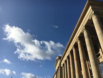 Low angle view of government building against blue sky