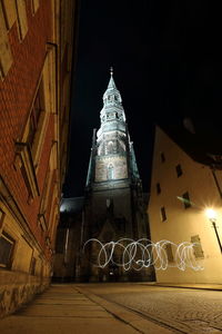 Low angle view of illuminated building at night