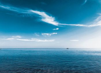 Scenic view of sea against blue sky