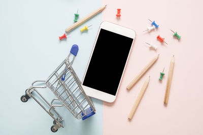 High angle view of smart phone on table