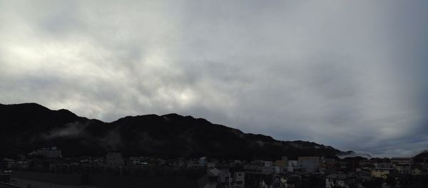 Cloudy sky over mountain range