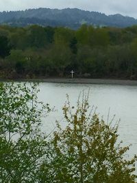 Scenic view of lake with mountains in background