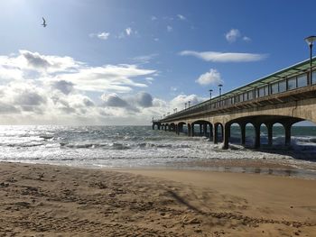 Bridge over sea against sky