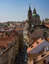 Aerial view of townscape against sky in city