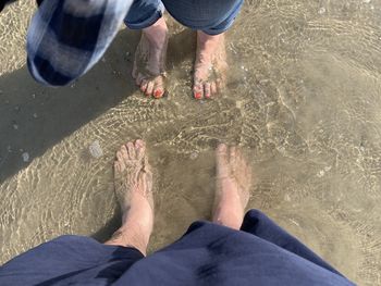 Low section of people on beach