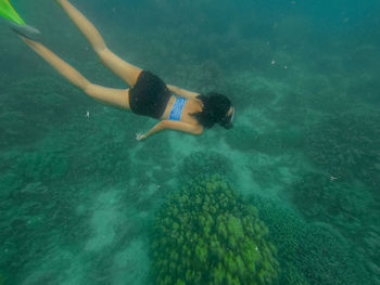 Woman swimming in sea