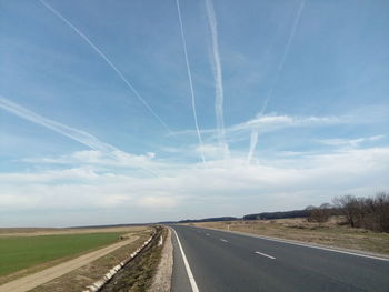 Road amidst landscape against sky