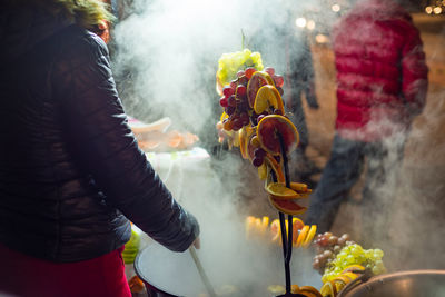 Midsection of person holding temple