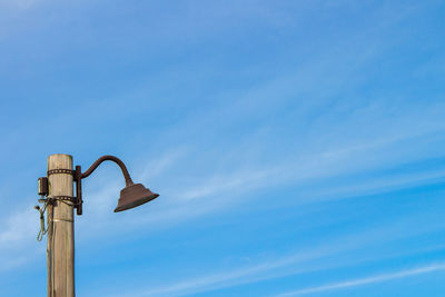 Low angle view of street light against sky