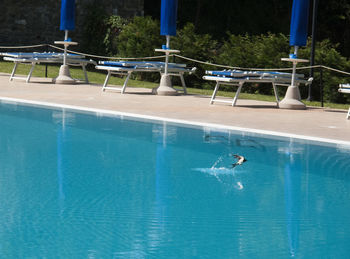 Man swimming in pool