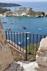 High angle view of rocks on sea shore