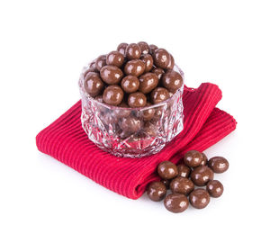 High angle view of cherries in plate against white background