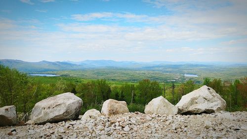 Scenic view of landscape against cloudy sky